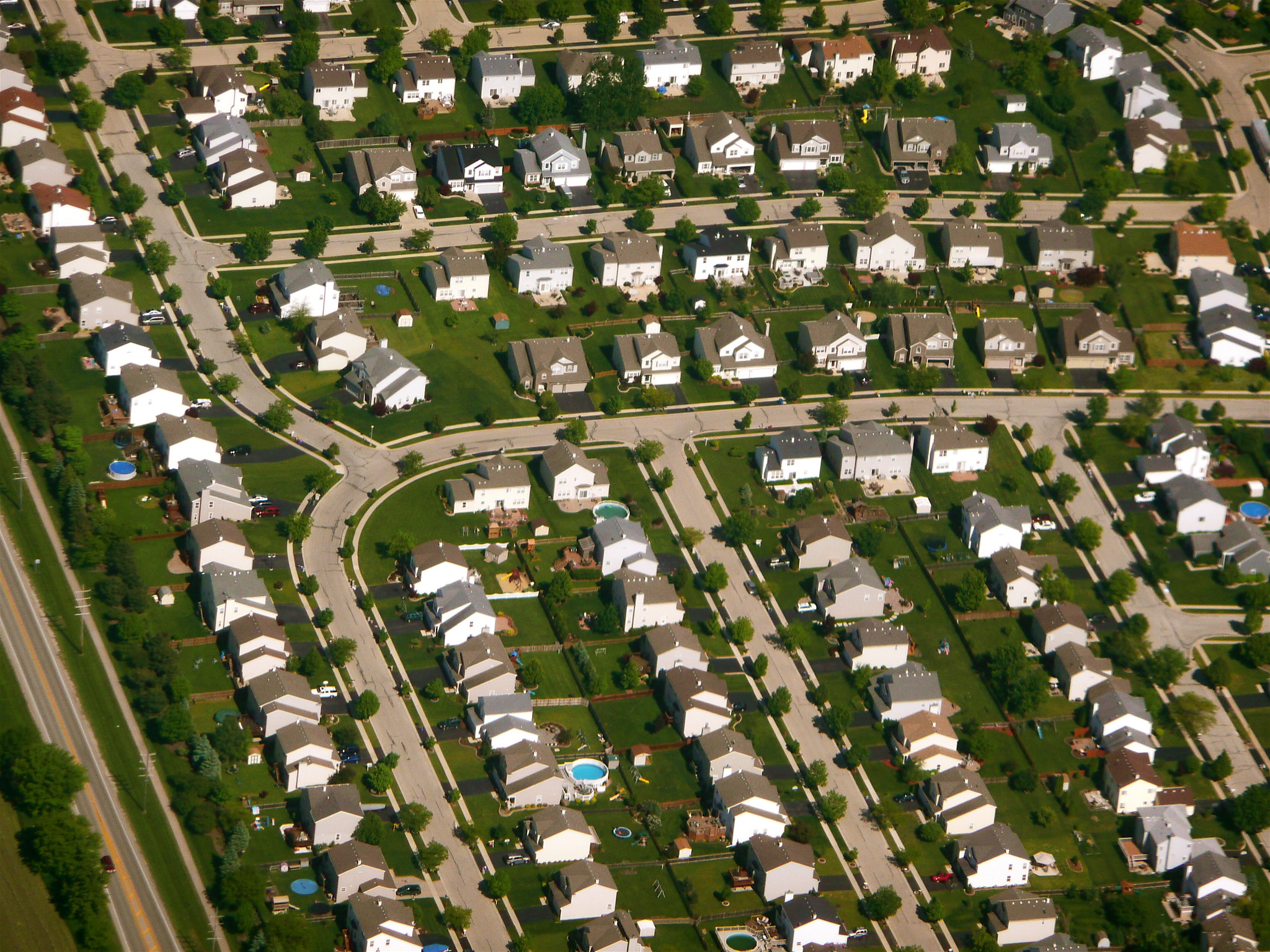 Consider the contrast between Jacobs diverse cities and the homogenous suburbs which became popular in post WWII America. Image is titled 'Chicago suburbs from the air' by Scorpions and Centaurs, CC BY-NC-SA 2.0.
